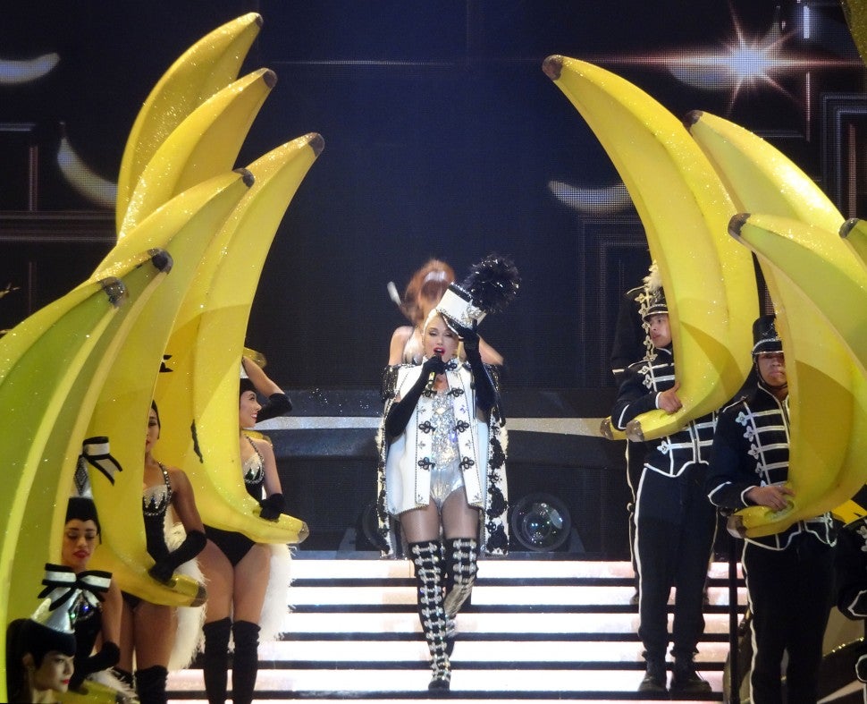 Gwen Stefani surrounded by a marching band holding giant bananas.
Image credit: 
Ronin 47/London Entertainment/SplashNews.com
