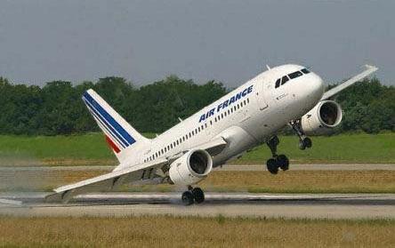 Air France airbus plane at a tenuous angle off of the runway.