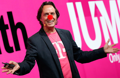 An image of the T-Mobile CEO with a pink "T" tee shirt and a sport jacket wearing a clown nose.