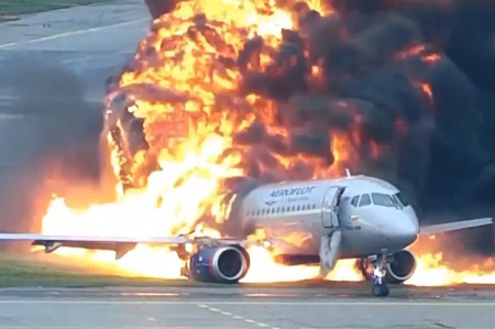 An aeroflot plane engulfed in flames.