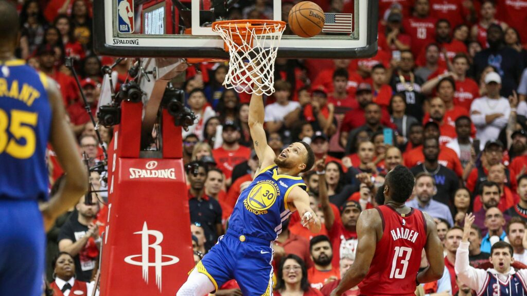 An image of Steph Curry missing a dunk.